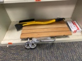 Items on shelf, thermostat a wall mount shower chair, and an ice scraper