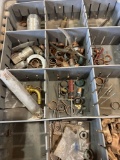 Various items such as pex rings, fittings, screwdriver, drill bits and other items