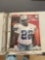 Photos of professional football players in a three ring binder