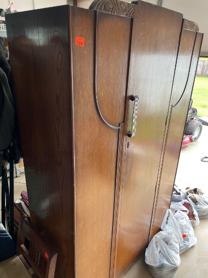 Armoire with hanging rack and mirror inside