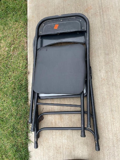2 metal folding chairs with cushion padding