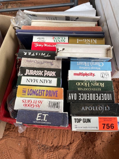 Crate with VHS tapes, books, farm decor hooks, and coin purse
