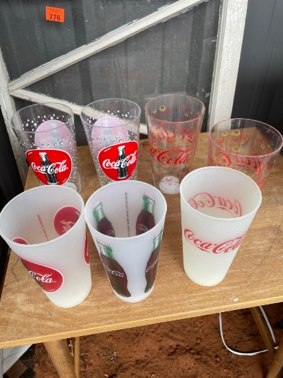 7 plastic Coca Cola glasses