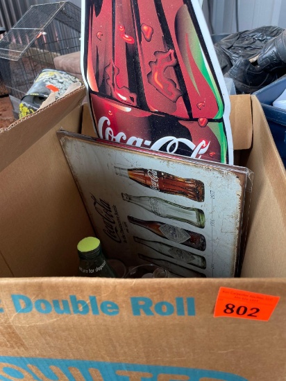 Coca Cola bottles, glasses, and signs