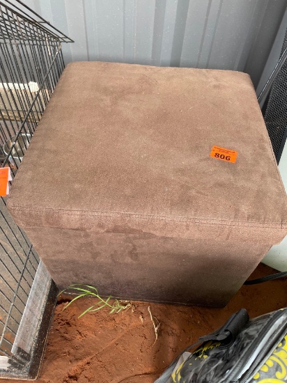 Small ottoman with storage, various items inside like shower curtain hooks, multi hanging hanger,