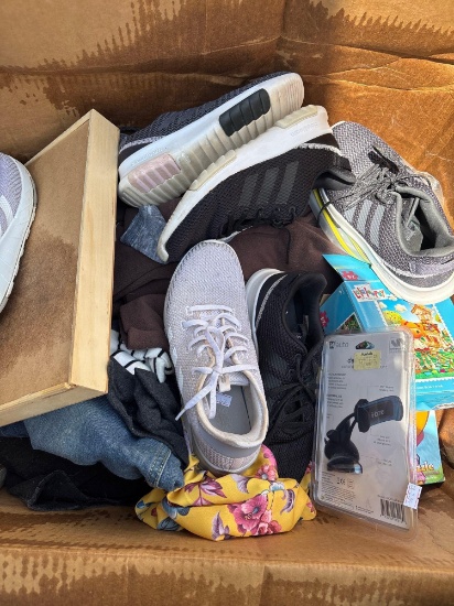 Box of various items shoes puzzles and clothes