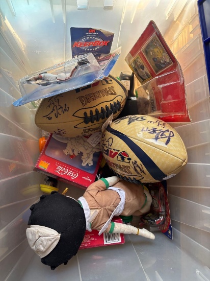 Tote with sports memorabilia and Coca-Cola