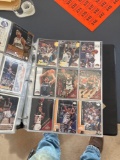 Basketball cards, the Denver Nuggets and Detroit Lions in a three ring binder