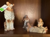 three women figurines, and one dog figuring