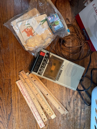 Cassette player, extension cord, rulers, mini sewing kit, and more