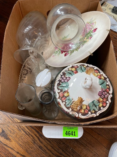 Box of decorative hanging plates, vases, Santa mugs, and other dishes