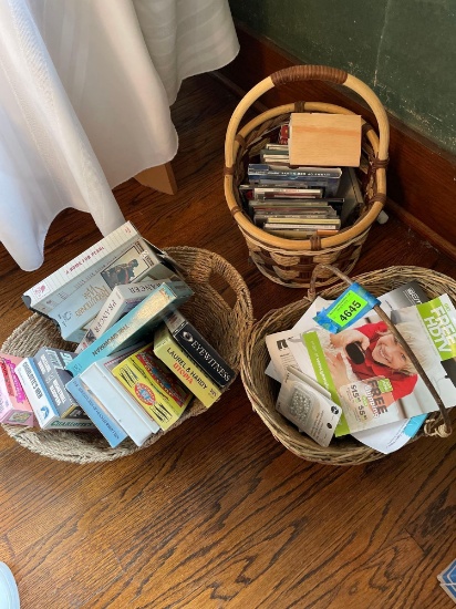 3 woven baskets with VHS tapes, cassettes, and CDs, see photos for titles and artists