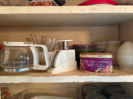 3rd shelf up, contents on shelf, Small kitchen scale, measuring cup, molds, and more