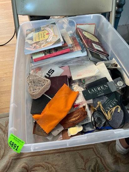 Storage tote with sewing items, needles and buttons, books (see photos for titles and authors) and
