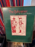 Bed rest, toy ironing board, framed declaration of independence, memo board, The Nutcracker print in