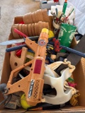 Tennis balls, toy, gun, ankle, weights, toy, cars, pens, and pencils and cups and more