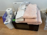 Microwave, toilet paper, bath towels and hand towels. Power surge cord