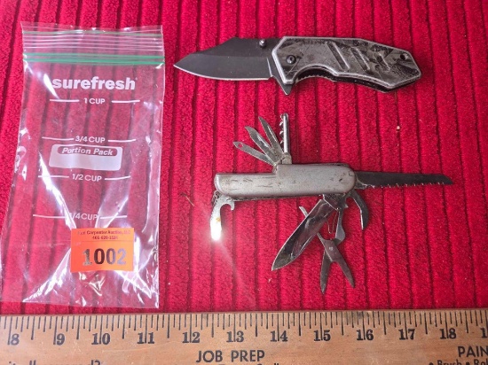 2 Knives. 1 Lock Blade with Belt Clip and 1 Camping/Survival Knife. Both one Money.