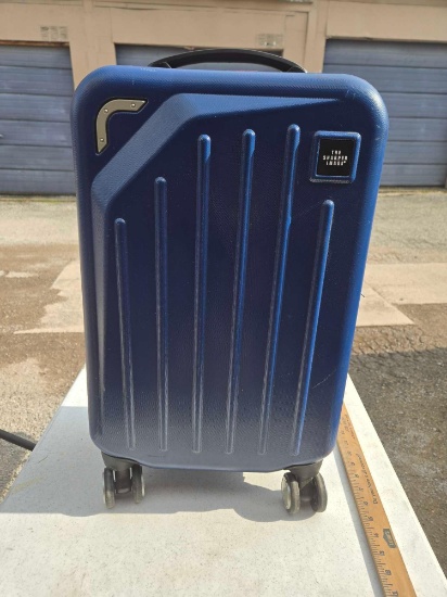 The Sharper Image Hard Case Suitcase. On Rollers with Extendable Handle.