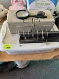 Small tote with stamps, label maker in case and hole punch