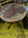 Wooden antiqueround end table on castors, damage to table top Measurements in photo