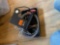 Small tape measure, small flashlight, hole saw and charging station