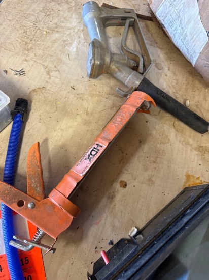 Grease gun and box with miscellaneous items