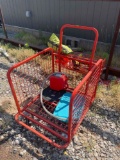 Red cart with hose and gas can