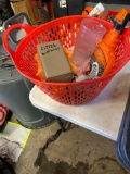 Plastic hand basket with ArmorAll, spray nozzle, shop rag, cup, glove and other items