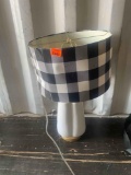 White lamp with checkard lamp shade