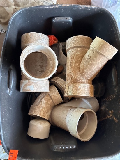 tub of mostly 4 in and 3 in fittings
