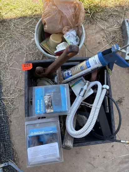Pipe wrenches and other items in crate
