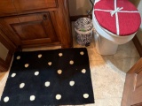 Bathroom rug, trash can and toilet cover