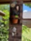 Hanging plant holder with hanging butterfly house