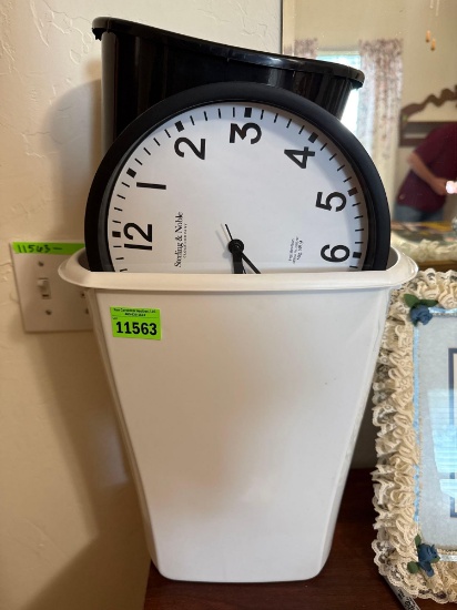 Trash can, hanging clock, mirror