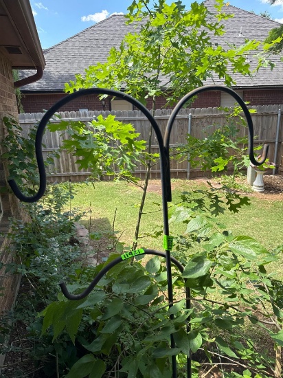 Two iron plant hangers