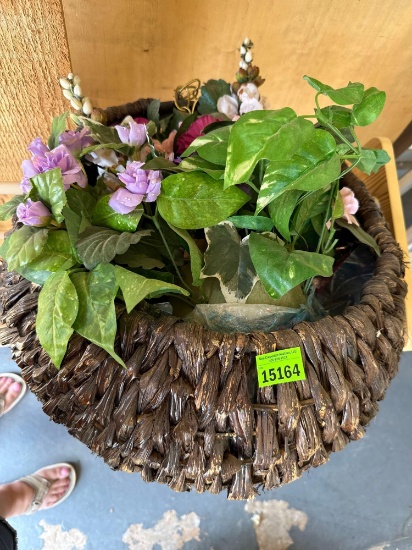 Wall hanging with floral arrangement