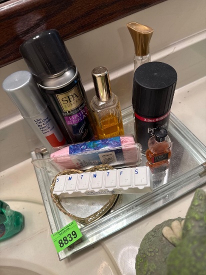 perfume, hairspray, medicine, organizer, and shower cap