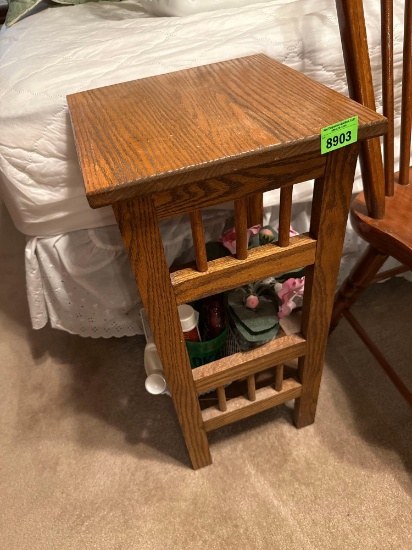 Side table, lotion, and greenery