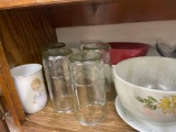 Items on shelf - dinner bowls, jelly jar glasses, coffee mugs