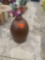 Brown vase with artificial flowers
