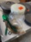 Pizza pan, green serving spoons, clear container