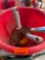 Red bucket with lawn tools