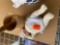 Wooden mortor and pestle and a doll