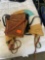 2 leather purses and one woven bag
