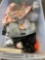 Tote with BMW license plate, fan, glass decanter, warmies, and misc items