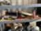Items on shelf, pex, raid, gopher bait, Stanley organizer, caulking gun, weedeater line