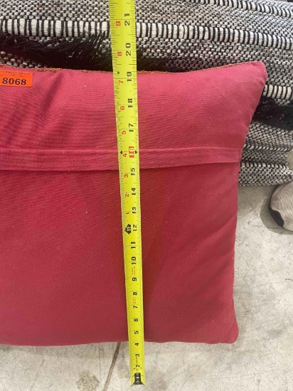 2 pillows and a rug