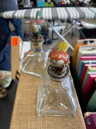 Glass bottle with birds on top