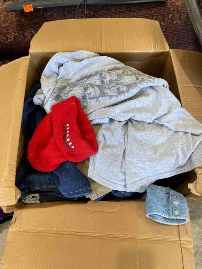 Box of shirts and jeans